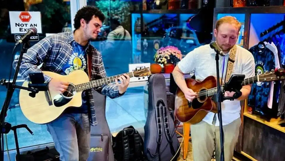 two men with guitars for open mic night at Stolen Sun