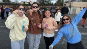 Some of the fifth-graders at Greystone Elementary School celebrate the completion of a Mini-Bubble Walk to support the Arc of Chester County.