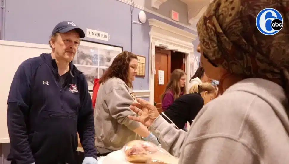 Dan Roberts giving out food