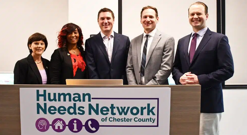 Chester County Commissioners Marian Moskowitz (left), Josh Maxwell (center) and Eric Roe (right) with Bridget Brown, Behavioral Health Crisis Response Program Director, and Joshua Bitler, Information & Referral Director for the new Human Needs Network of Chester County.
