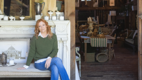 Meg Veno at her other farm surrounded by antiques