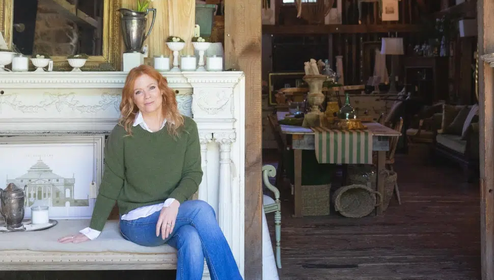 Meg Veno at her other farm surrounded by antiques