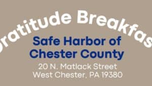 A sign announces Safe Harbor of Chester County's upcoming gratitude breakfast and open house.