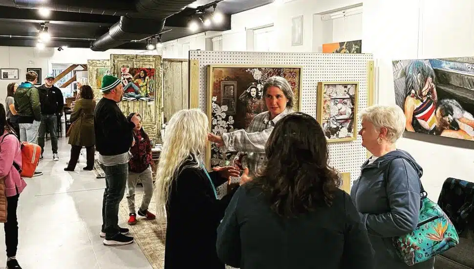 people walking around artist studios