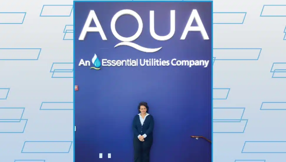 Nuhamin Getachew Gebremariam standing in front of Aqua backdrop