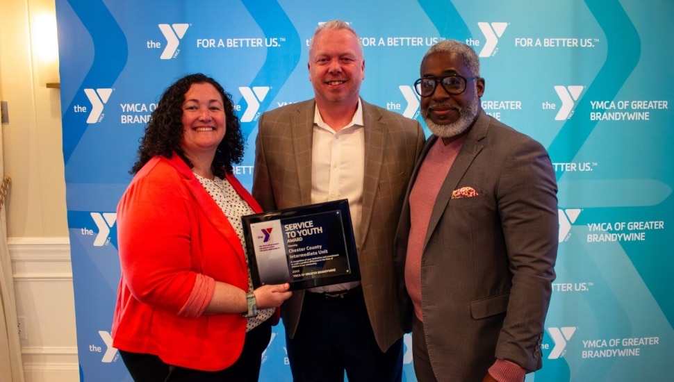 The team from the Chester County Intermediate Unit accepts the YMCA Service to Youth Award from Bertram L. Lawson II, President and CEO of YGBW.