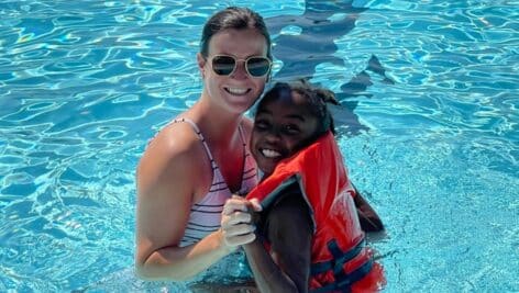 Swimmers enjoy the outdoor pool at the YMCA.