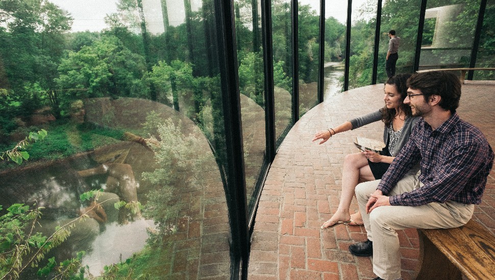 Couple visiting the Brandywine Museum of Art take in the view of the Brandywine River.