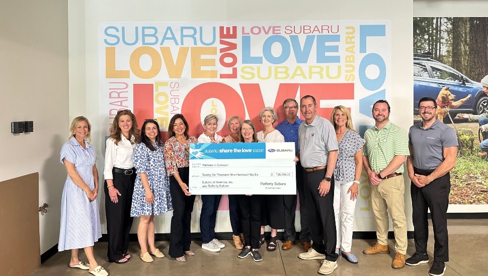 Members of PIO receiving the $26,956 check from Rafferty Subaru's Share the Love Event.