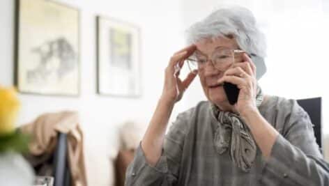 A distressed older lady on the phone with a Medicare scammer.