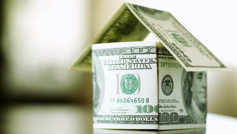 a house made from bills of 100 dollars