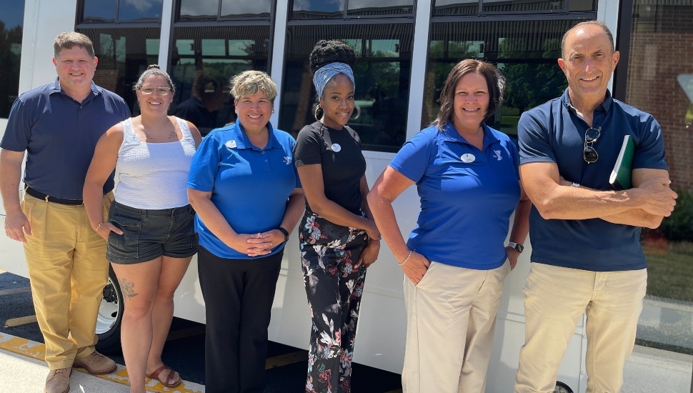 Representatives from the Transportation Management Association of Chester County (TMACC) and the YMCA of Greater Brandywine (YGBW) welcome the ChescoBus to the Coatesville YMCA on Monday, Jun. 24, 2024, to celebrate the expansion of the Coatesville Link bus route. Pictured (L to R): Tim Phelps, Ashely Ball, Terri Edgar, Brittney Richardson, Jess Rigo and John Meisel.