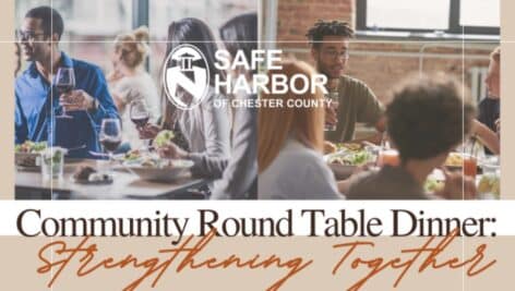 People in a restaurant enjoying dinner and a discussion. A promotion for the Safe Harbor Community Round Table Dinner.