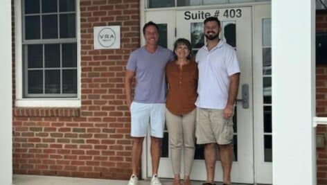 Group gathered in front of VRA Realty, which is set to expand with a new West Grove location and will open in Ridley Park and Chadds Ford this month.