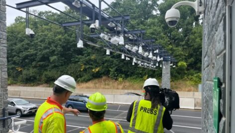 workers removing toll booths