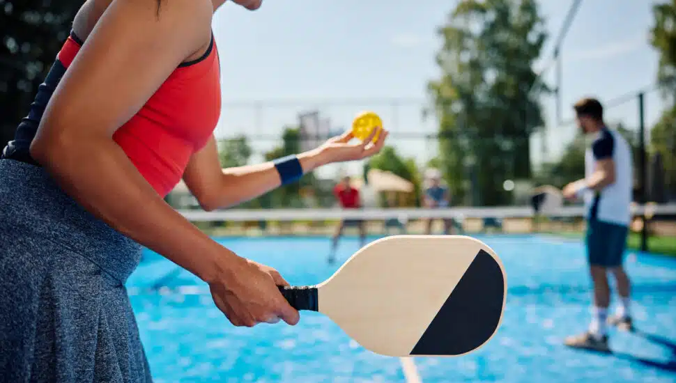 Pickleball players out on a court during a game.