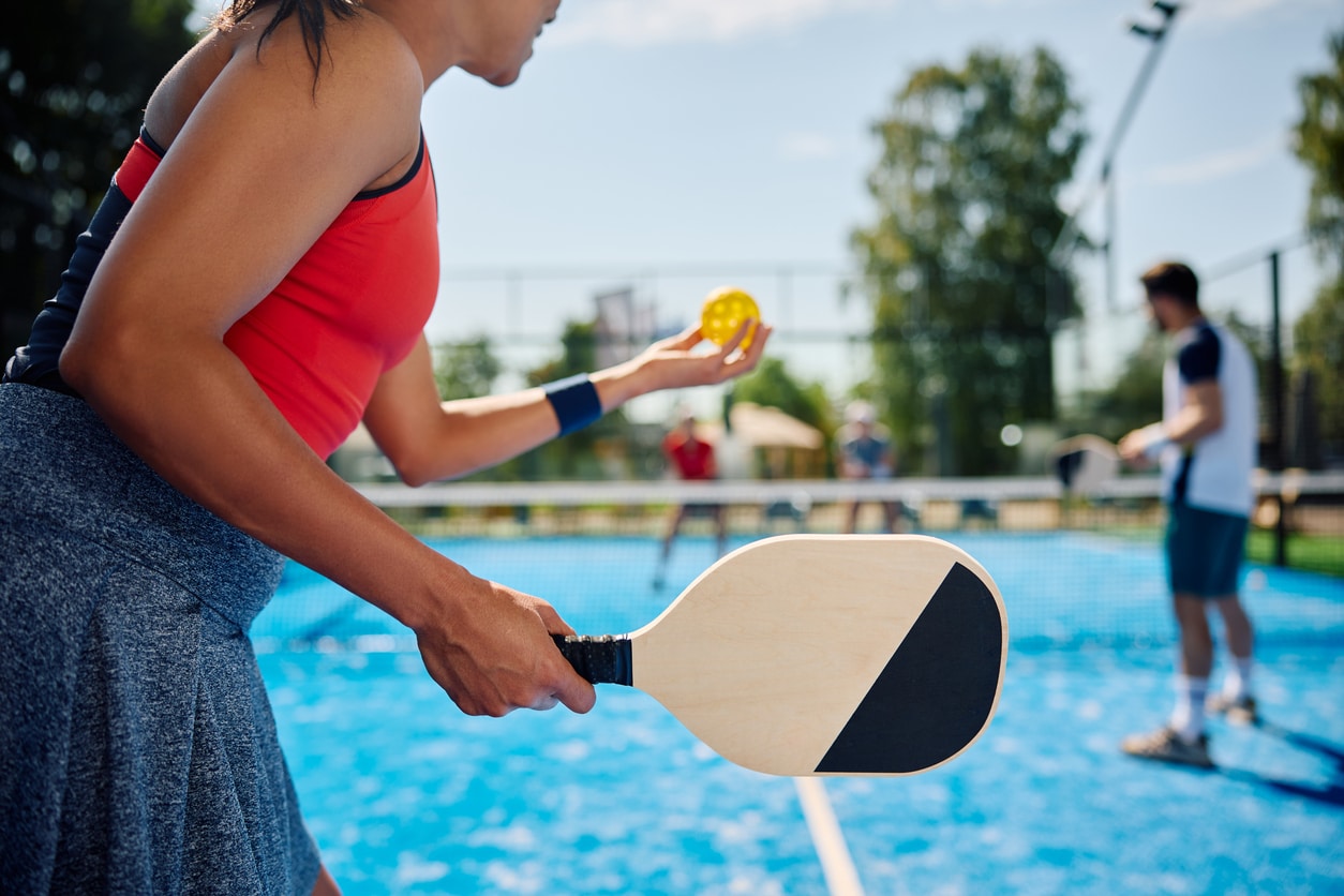 Pickleball players out on a court during a game.