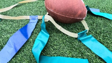 close up of flag football gear and football.