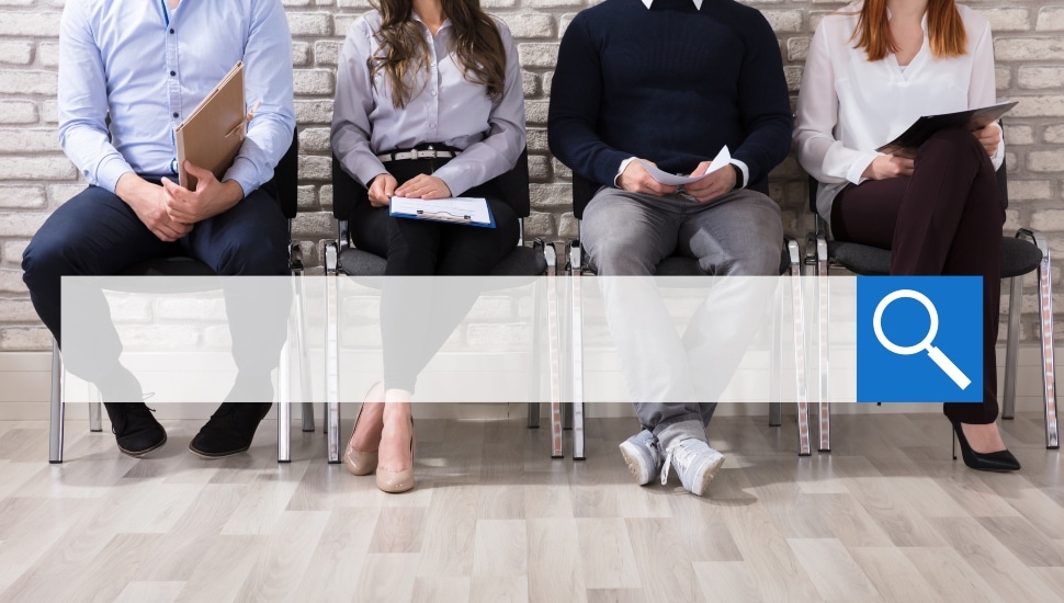 people waiting on chairs for job interview