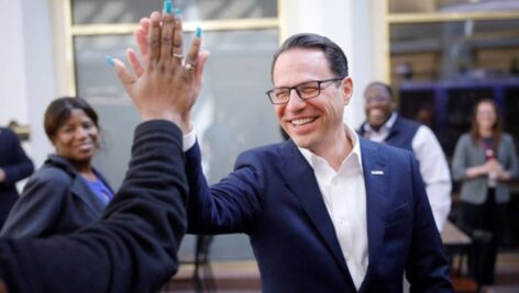 Pennsylvania Gov. Josh Shapiro high-fiving person