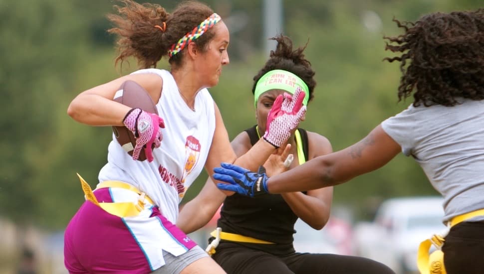 women playing flag football