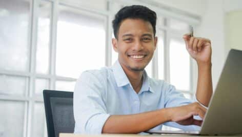 A student working at his computer.