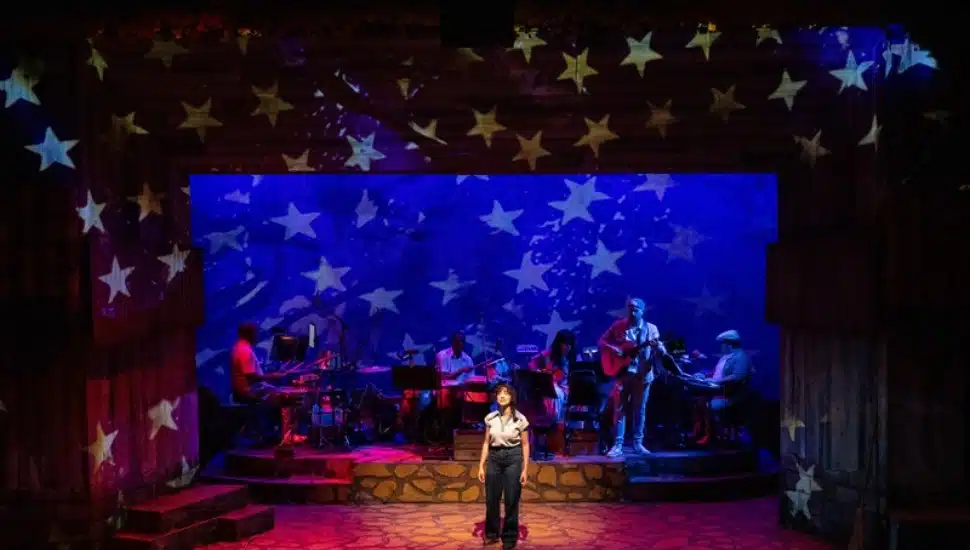 An actress on stage at People's Light.