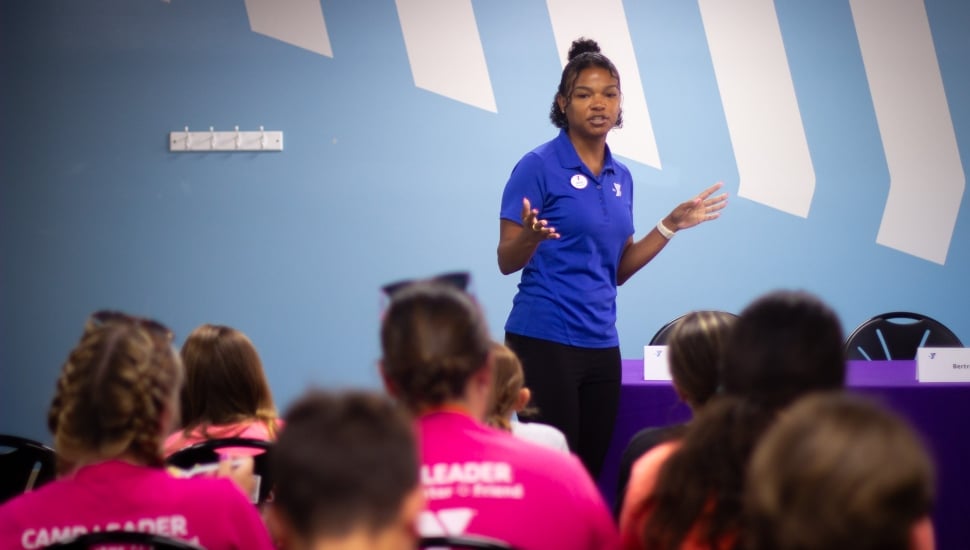 Jazmyn Hudson, Association Director of Teen Programs, speaks to a group of teens at the Jennersville YMCA.