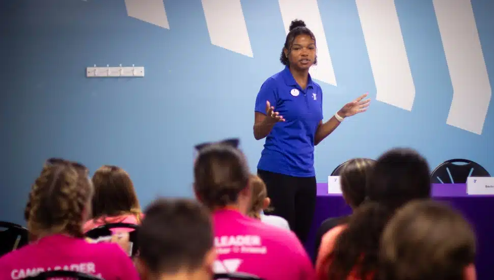 Jazmyn Hudson, Association Director of Teen Programs, speaks to a group of teens at the Jennersville YMCA.