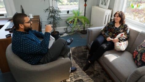 A man and woman talk during a counseling session.