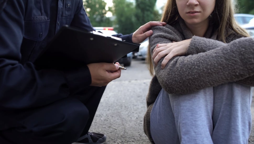 police comforting woman