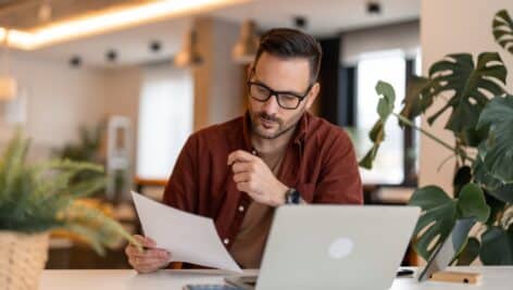 Small business owner looking over financials.