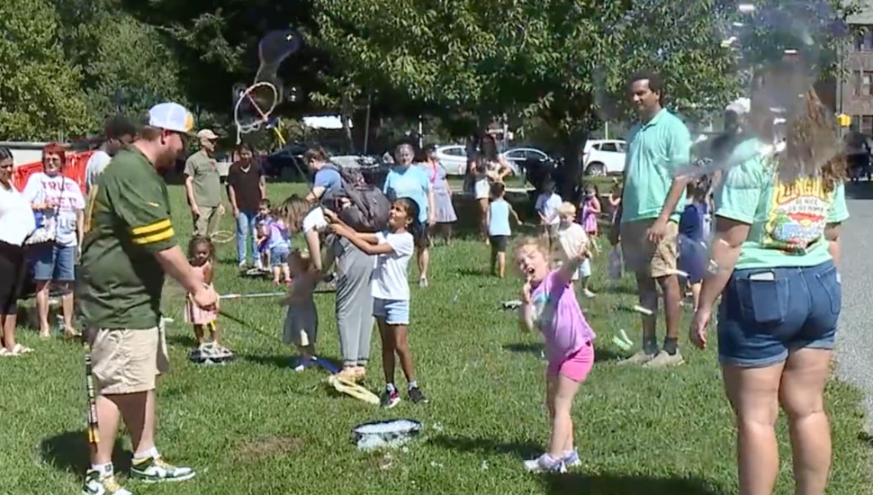 people blowing bubbles