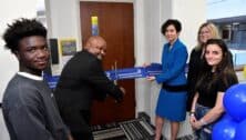 (L to R) Student Alvin Gayee; Dr. Kendrick Mickens, DCCC’s Director, Student Outreach and Success; DCCC President Dr. Marta Yera Cronin and student Sarah Staquet cut the ribbon.