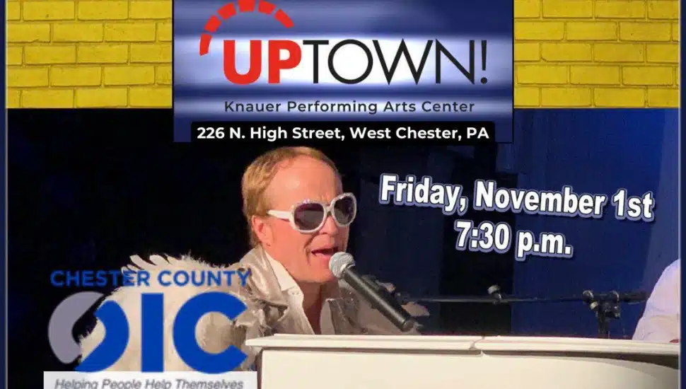 A poster promoting the following/showcasing this info: To celebrate 45 years of service, Chester County Opportunities Industrialization Center, Inc. (CCOIC) is celebrating with a benefit concert, hosted by Uptown! Knauer Performing Arts Center (226 N. High Street, West Chester) as part of its Artful Impact on Nov. 1. A reception will take place from 5:30-7:15 PM, and the show begins at 7:30 PM. Elton John impersonator is pictured performing behind the piano.