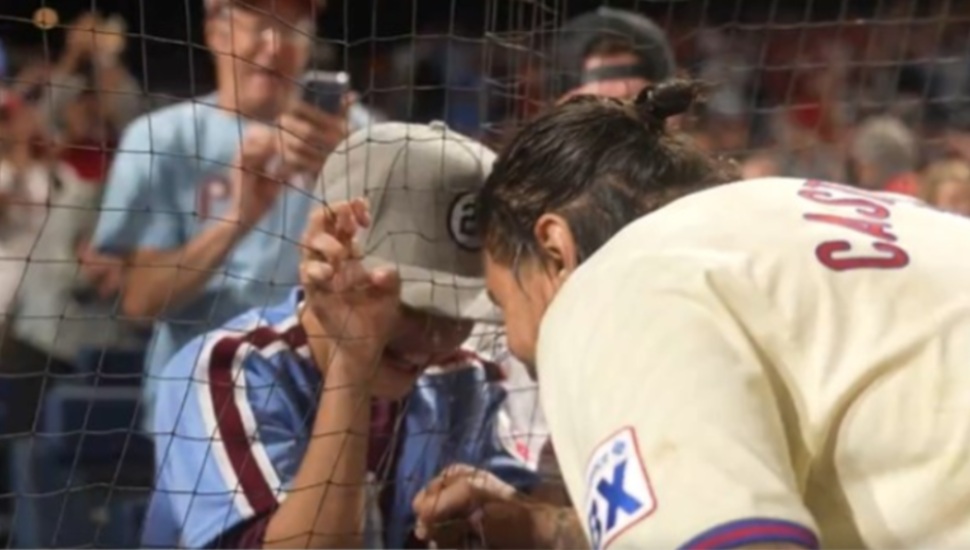 Phillies outfielder Nick Castellanos shares a special moment with his son after hitting a walk-off single to tie the playoff series 1-1.