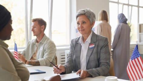 Older woman casting her vote.