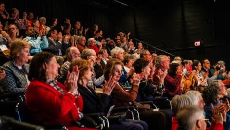 An applauding audience at a People's Light production.