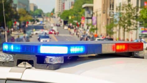 police car lights with city in background