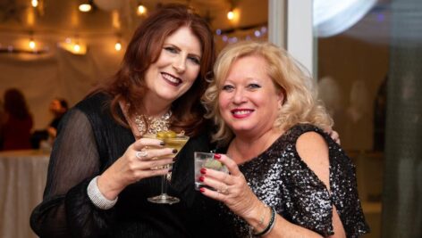 Two women enjoy drinks at the 2023 West Chester Charity Ball.