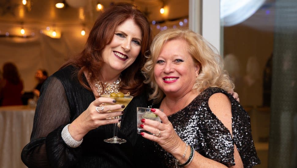 Two women enjoy drinks at the 2023 West Chester Charity Ball.