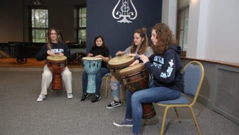 Music students of Immaculata University gathered playing music.