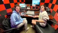 two students in radio booth