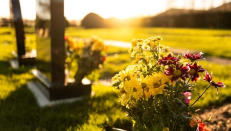 grave marker and flowers