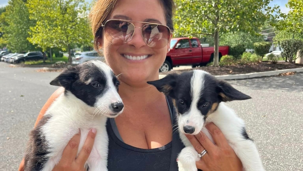 woman with two puppies
