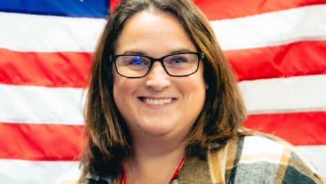 Susie Fink in front of american flag