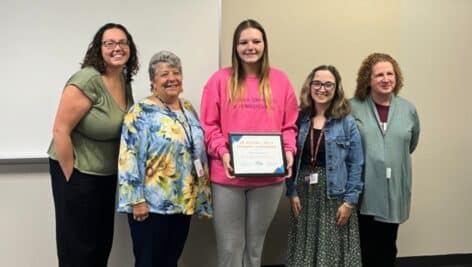 Mia Fragale holds her scholarship award. With her are (from left) KaSaundra Willis Nikola Freeland, Jessica Amarant, and Diane Berman.