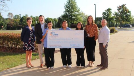 (From left) Jennifer Hernandez, Coordinator of Business Development; Matt Przywara, CCRES Executive Director; Scholarship Recipients Elizabeth Lopez Zavala, Geraldine Damian Vazquez, Estefani Nava-Renteria, Katie Bickel, TCHS Pennock's Bridge School Counselor; Brian Hughes, TCHS Pennock's Bridge Principal.