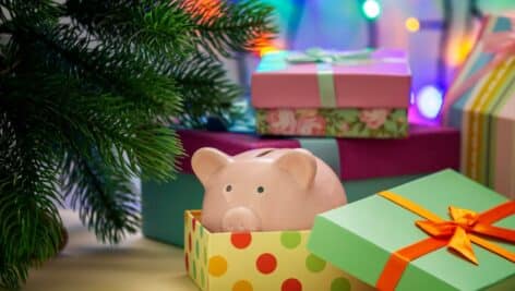 piggy bank inside a gift box, indicating the gift of savings.