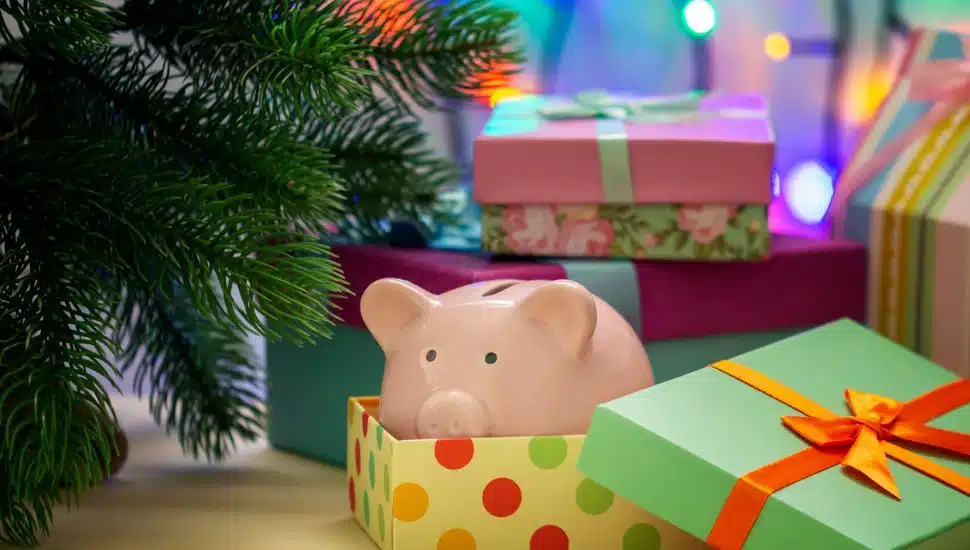piggy bank inside a gift box, indicating the gift of savings.